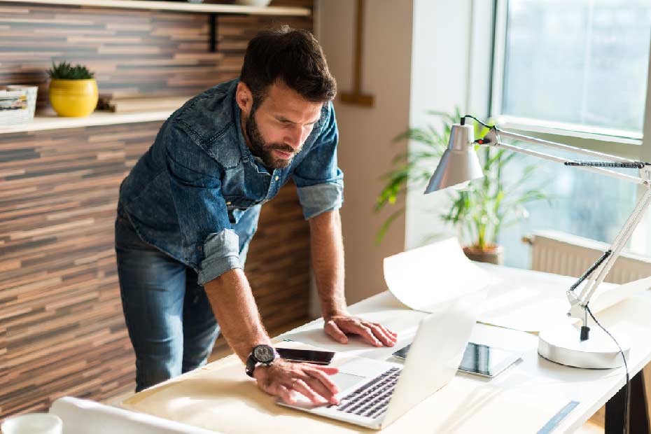 Handsome man working in a design office