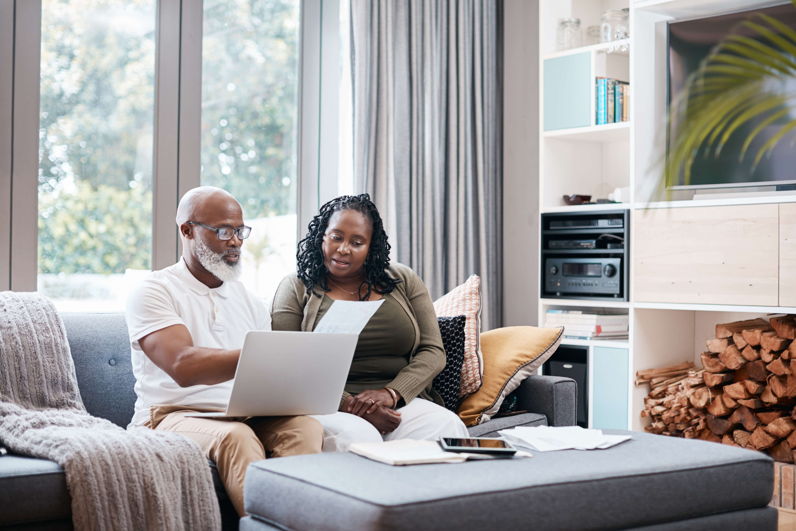 Senior couple making plans on laptop