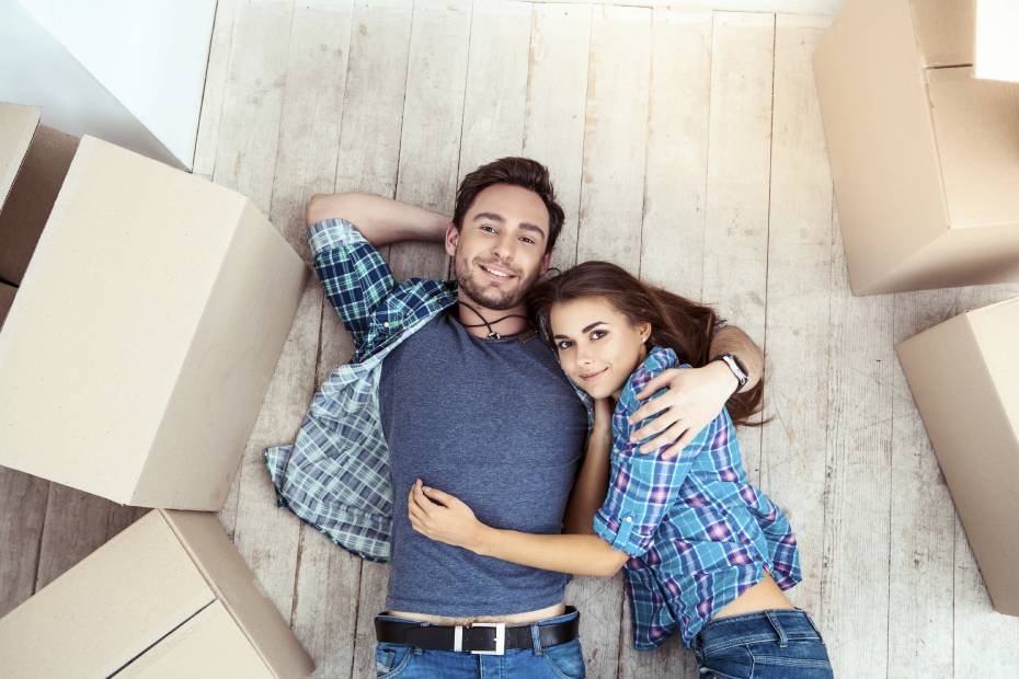 Couple hugging after moving into their new home
