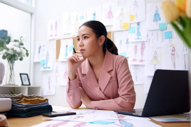 Woman working at a desk.