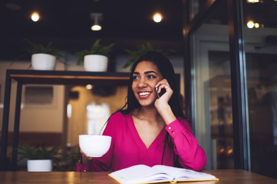 Female on the phone, coffee shop