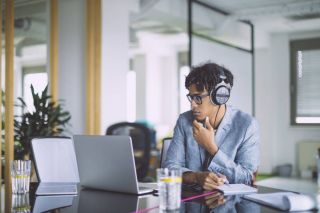 Business owner listening to podcast