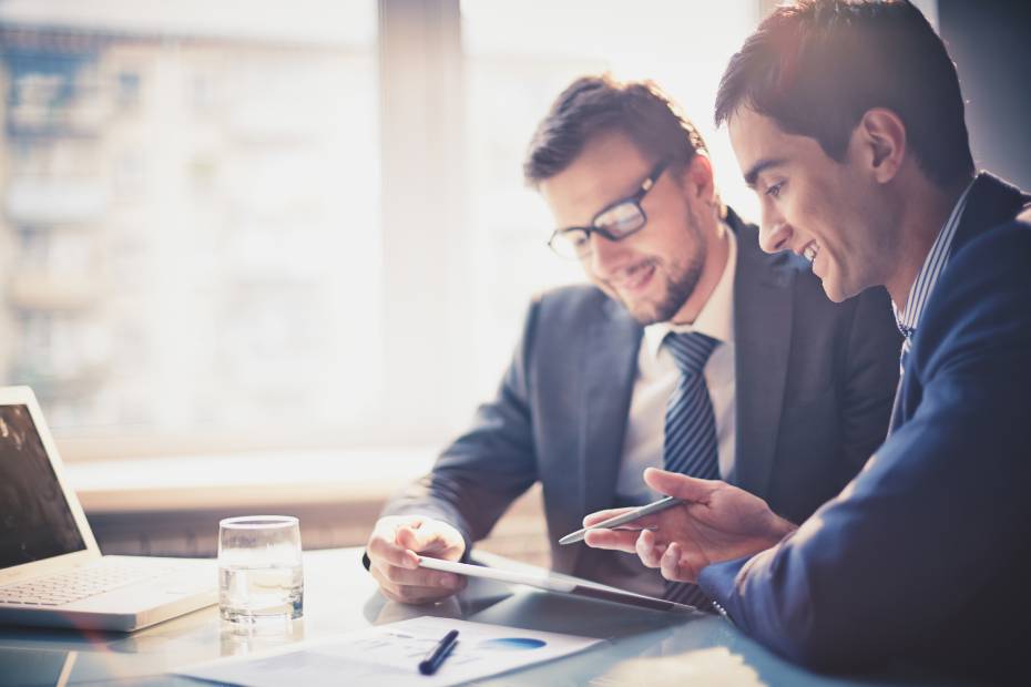 Two male executives reviewing a cyber security plan