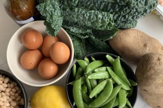 Raw ingredients sit on a kitchen counter