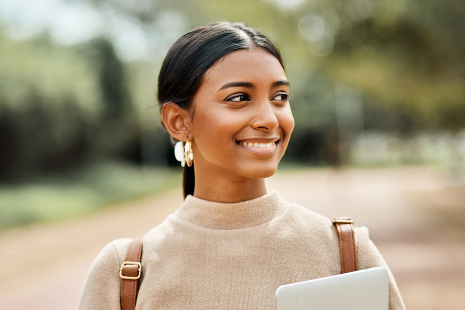 Cropped portrait shot of an attractive young female student on outside campus