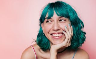 Lady with green hair smiling