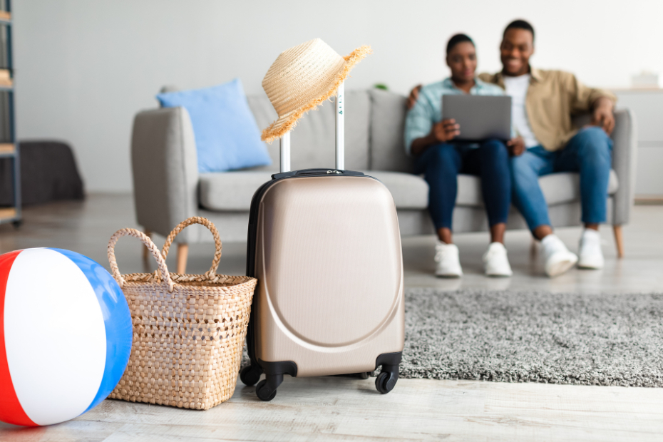 African American couple on Vacation Using Laptop to do banking