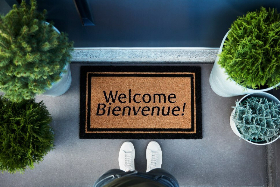 Welcome mat at the front door of a house.